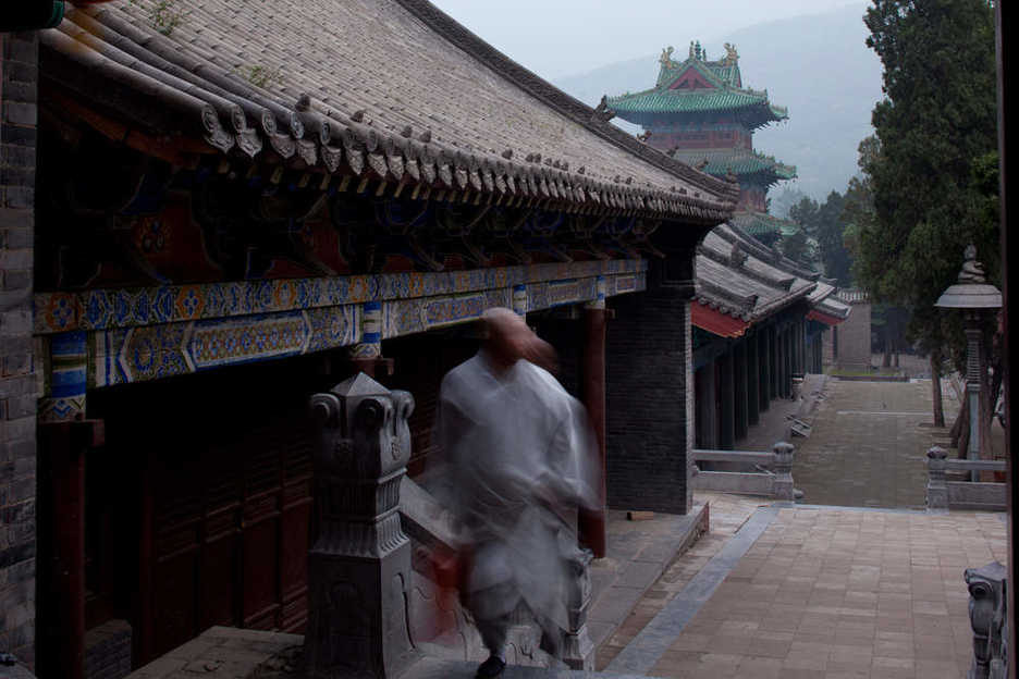 Monk walking through Shaolin Si in Dengfeng, Henan province, China