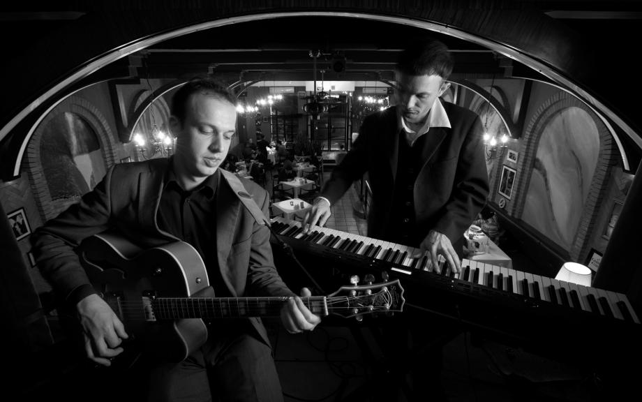 Jazz guitarist Thomas Hoogland and pianist Christopher Stiles pose at Vino Restaurant and Bar in Tianhe District, Guangzhou