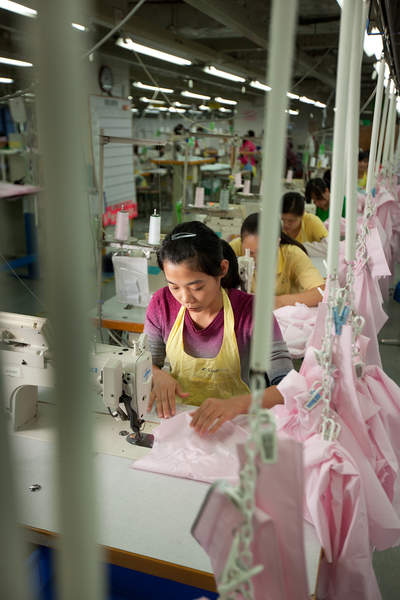 Workers assemble shirts at the Lever Style factory in Shenzhen, China.