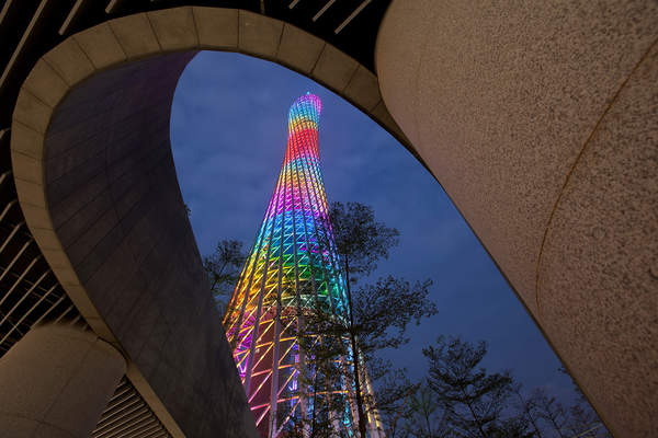 The Canton Tower is illuminated at dusk in Haizhu, Guangzhou, China.