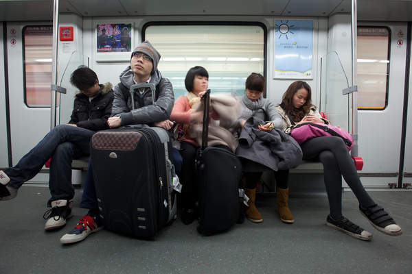 People ride the Guangzhou Metro subway system