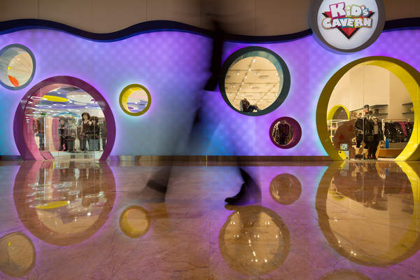 A person walks by the Kid's Cavern department store in Macau, China.