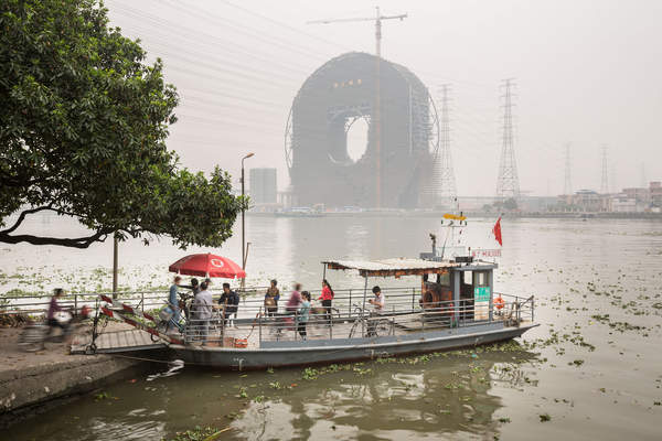 People board a ferry in Panyu