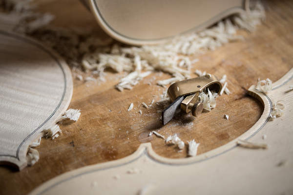 Violin parts and a violin making plane are arranged at Danuta Pawlikowska's workshop