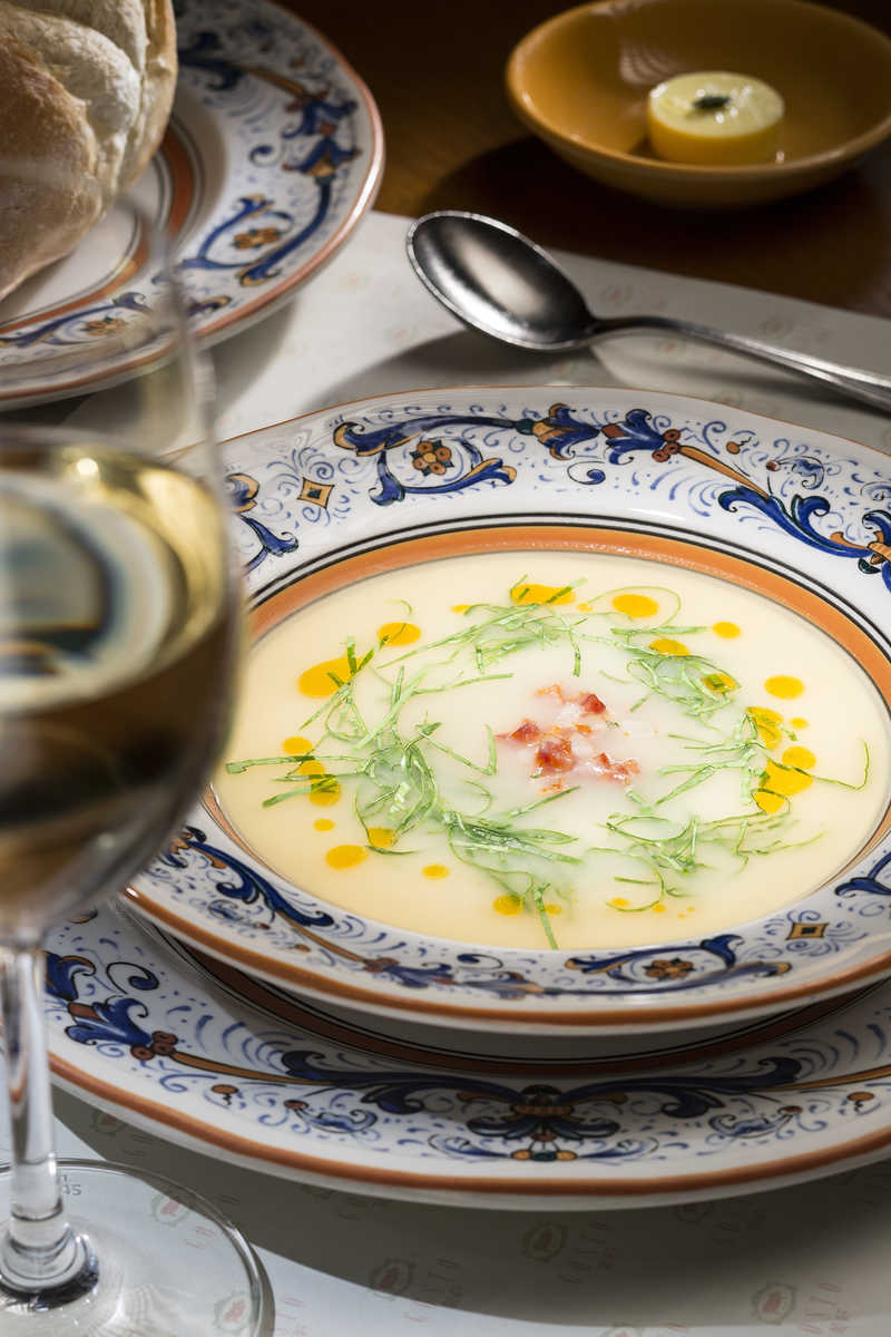 Potato soup with green cabbage and chorizo oil.