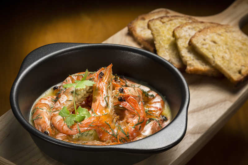 Sauteed prawns with portuguese beer, chili, and garlic butter.