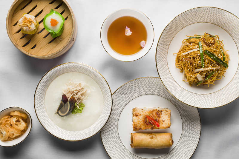 Dim sum set, including congee and fried noodles.