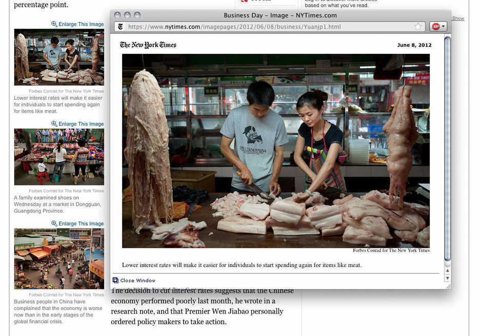 Butchers work with meat in Qingxi, Dongguan, Guangdong Province, China