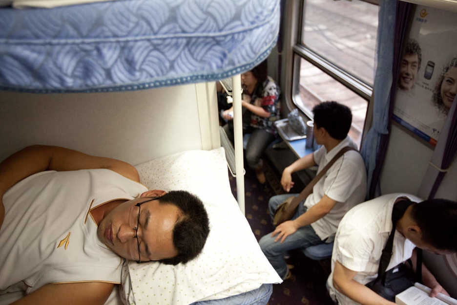 Passengers aboard a train from Guangzhou to Zhengzhou, China.