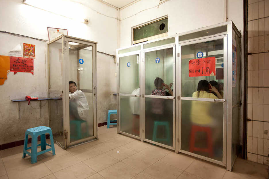 Phone booths in an old neighborhood in east Tianhe district, Guangzhou.