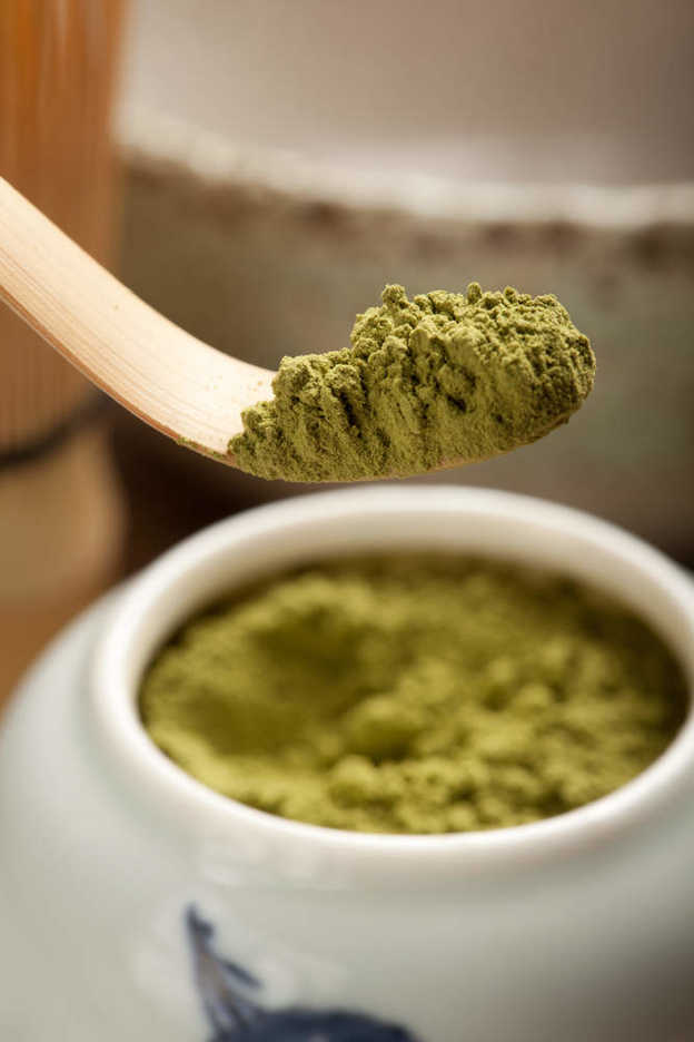 A heaping chashaku full of Japanese matcha powder.