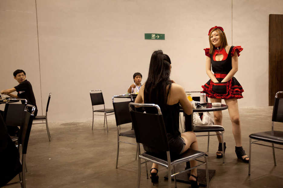 Entertainers mingle with trade fair visitors at the Asia Adult Expo