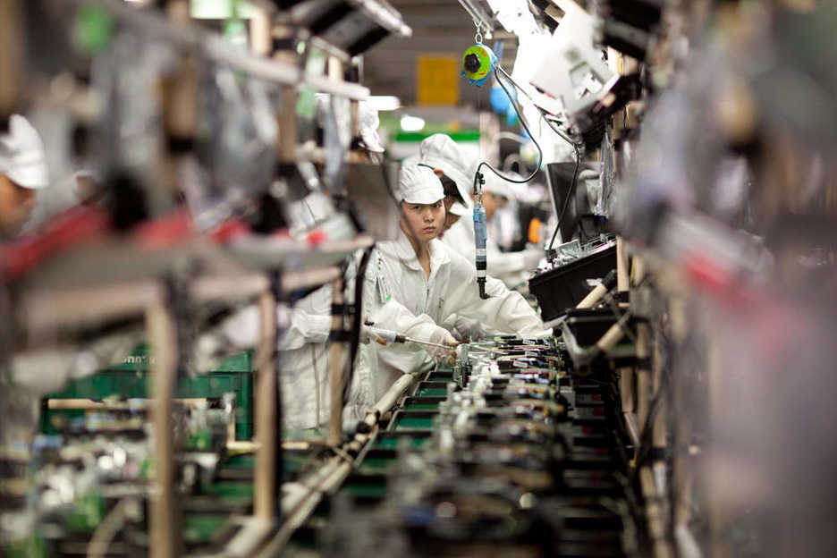 Foxconn Workers assemble computer printers in Shenzhen China.