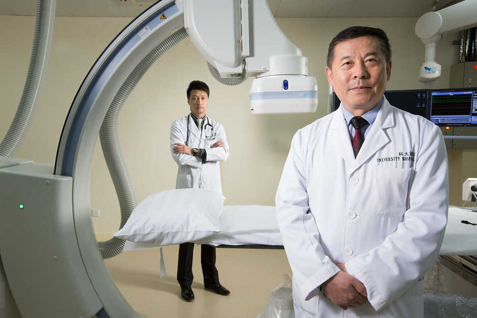 Doctors Leong Man Kin and Jin Chun, cardiologists at Centro Medico Pedder, pose at the Macau University of Science and Technology hospital in Macau, China.