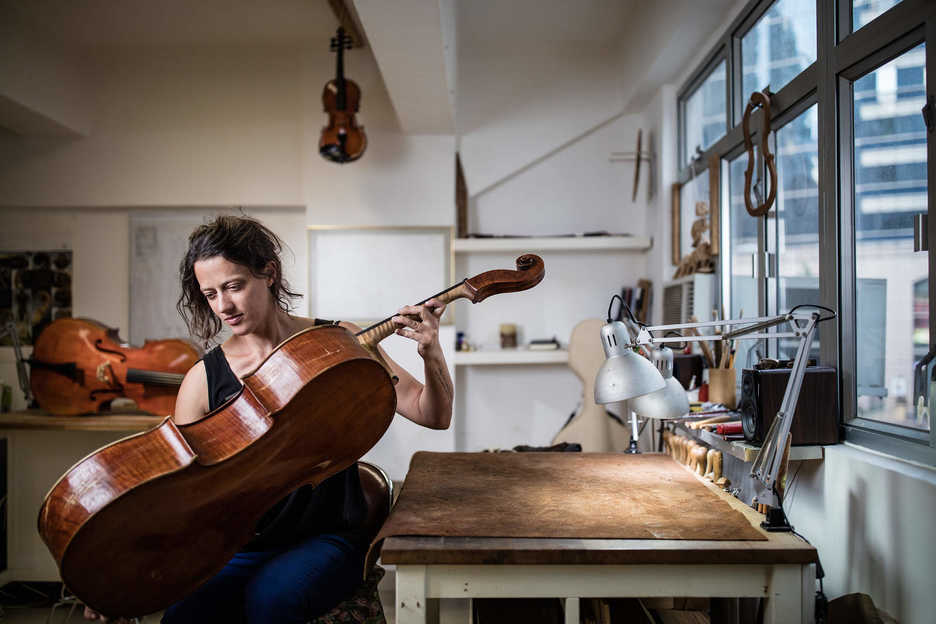 Céline Garnier, violin restorer, poses at her workshop in Hong Kong