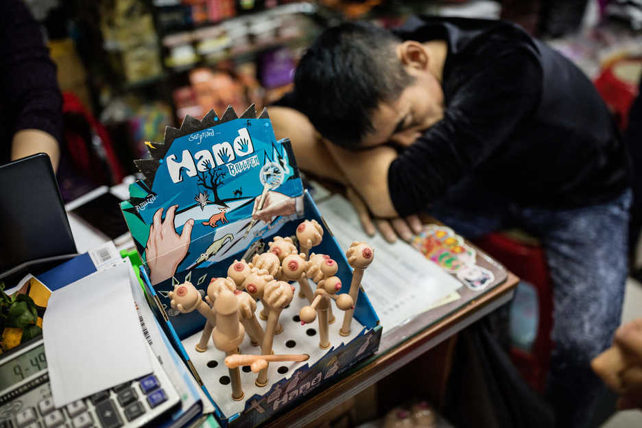 Adult novelty pens are displayed at a sex shop