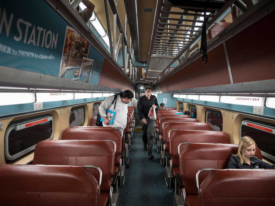 Jonathan Castillo chooses a seat in a commuter train car in Chicago