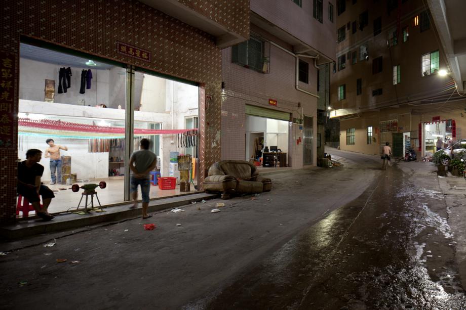 A man works in a small factory in Yongtai Village