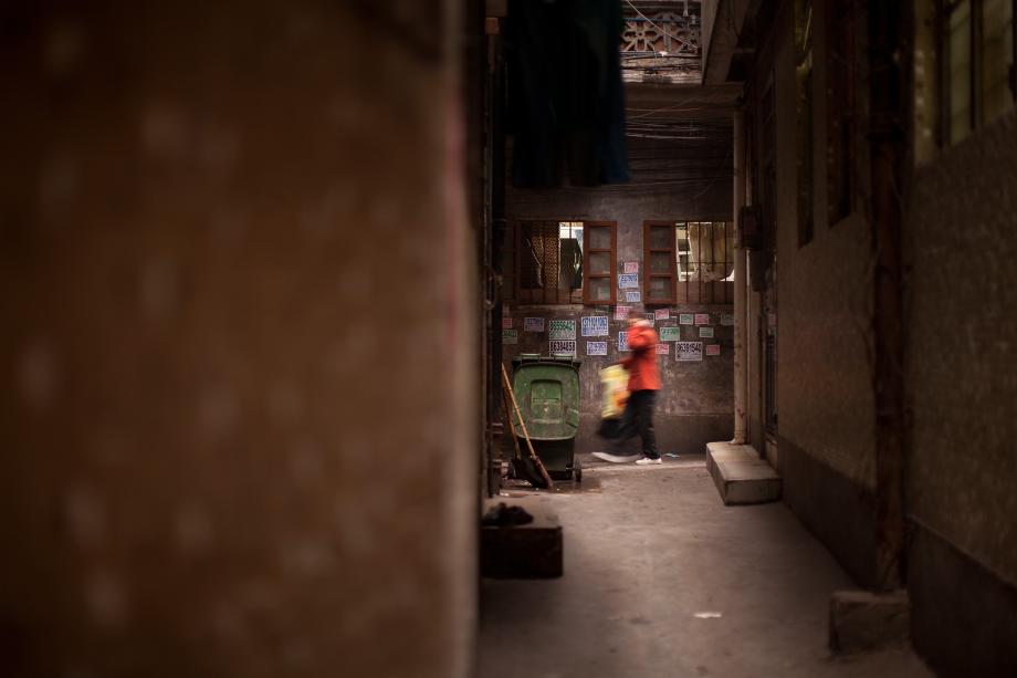 A woman walks in Sanyuanli Village