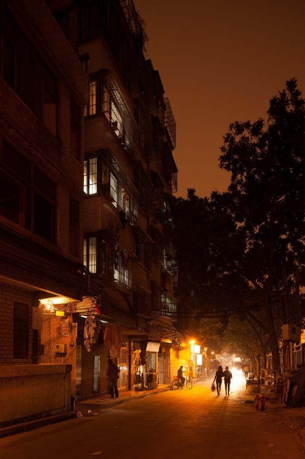 People walk on the outskirts of Sanyuanli Village