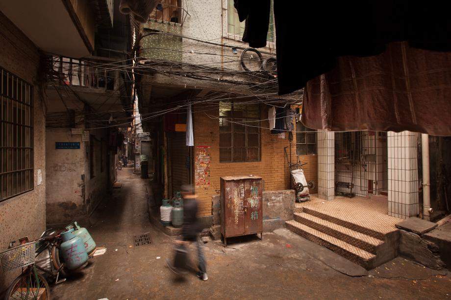 A man walks through a section of the Sanyuanli Village in Baiyun, Guangzhou, China