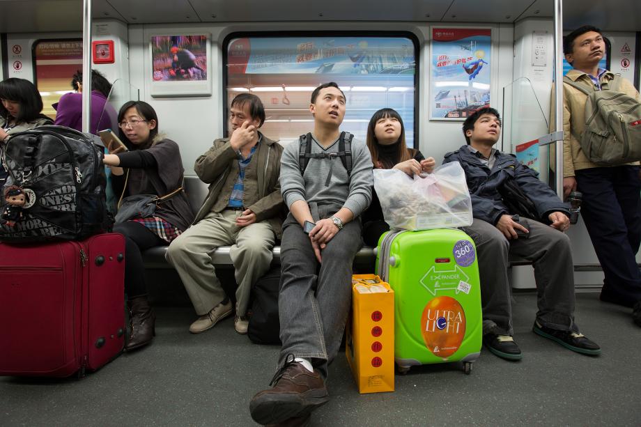 CNY metro riders in Guangzhou, China.