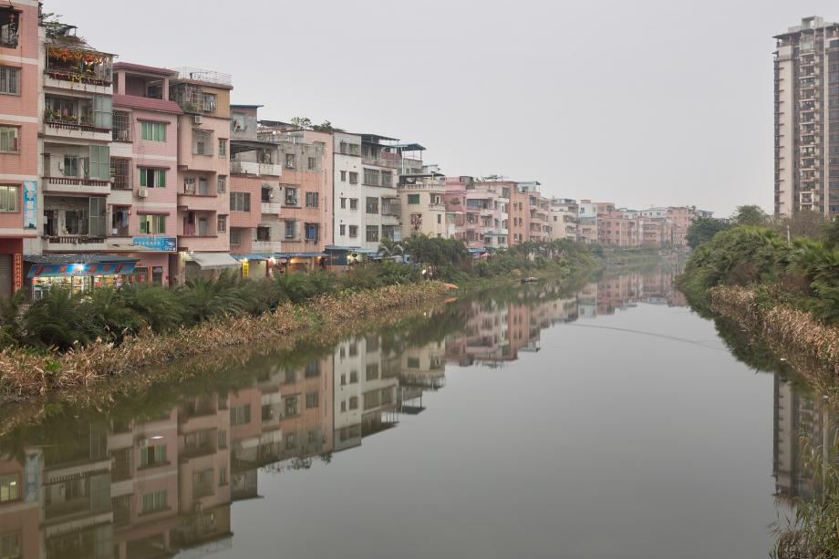 Houjiaocun, an urban village, is seen at dusk in Haizhu District